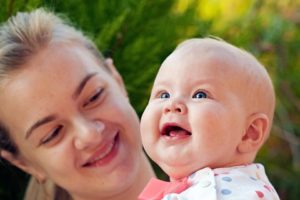 Baby Nastia, smiling with her mom